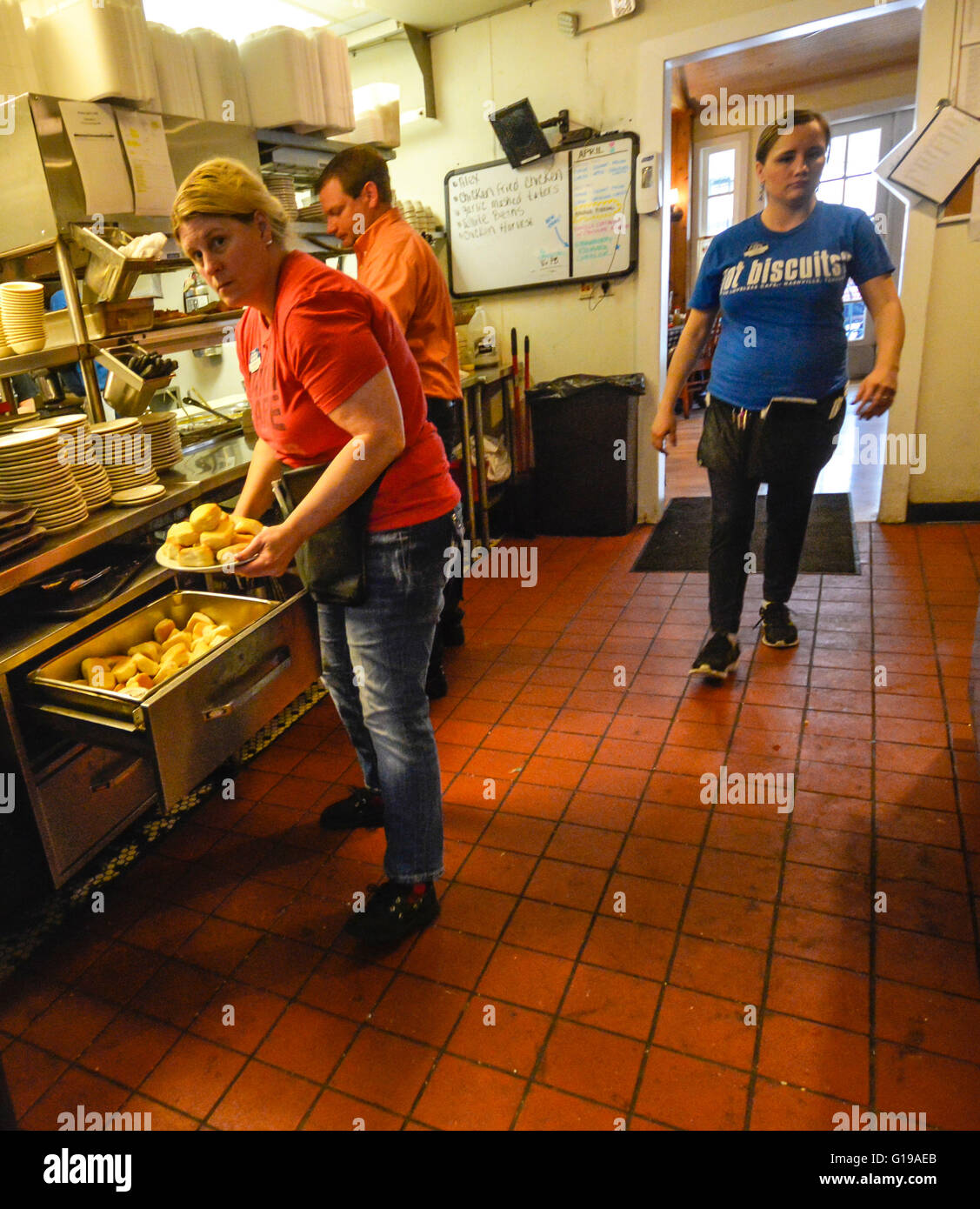 A waitress piles up Hot biscuits in the kitchen at the famously busy Loveless Cafe & Motel Nashville TN Stock Photo