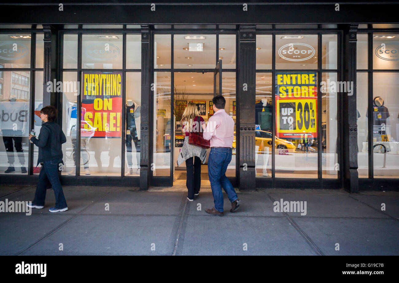 Liquidation signs are featured in the Scoop NYC store in the Meatpacking District in New York on Wednesday, May 11, 2016. The 20 year old clothing chain is shutting down and closing all of its stores citing high rents and other retail competition. Scoop NYC is currently owned by private equity firm Yucaipa Cos.  (© Richard B. Levine) Stock Photo