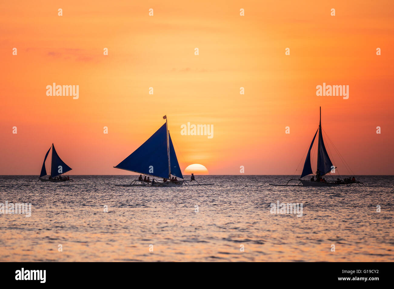 Sunset seascape with a sailboat Stock Photo
