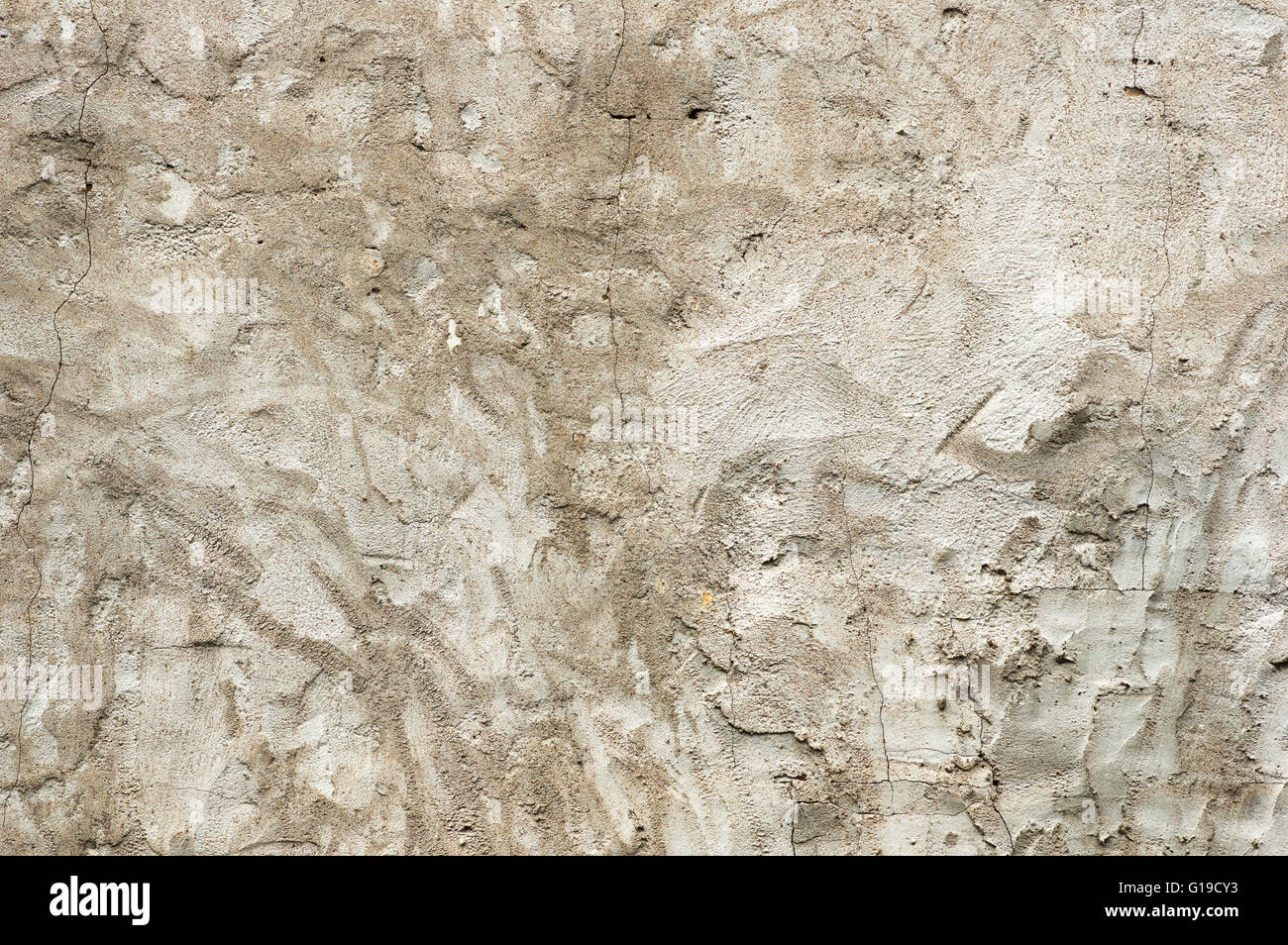 old gray cracked stucco wall background texture Stock Photo