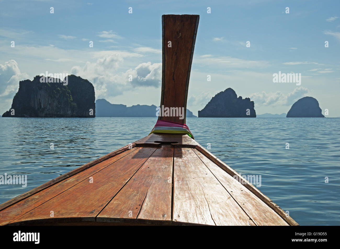 longtail boat prow in Thailand in the Andaman Sea with islands off the bow Stock Photo