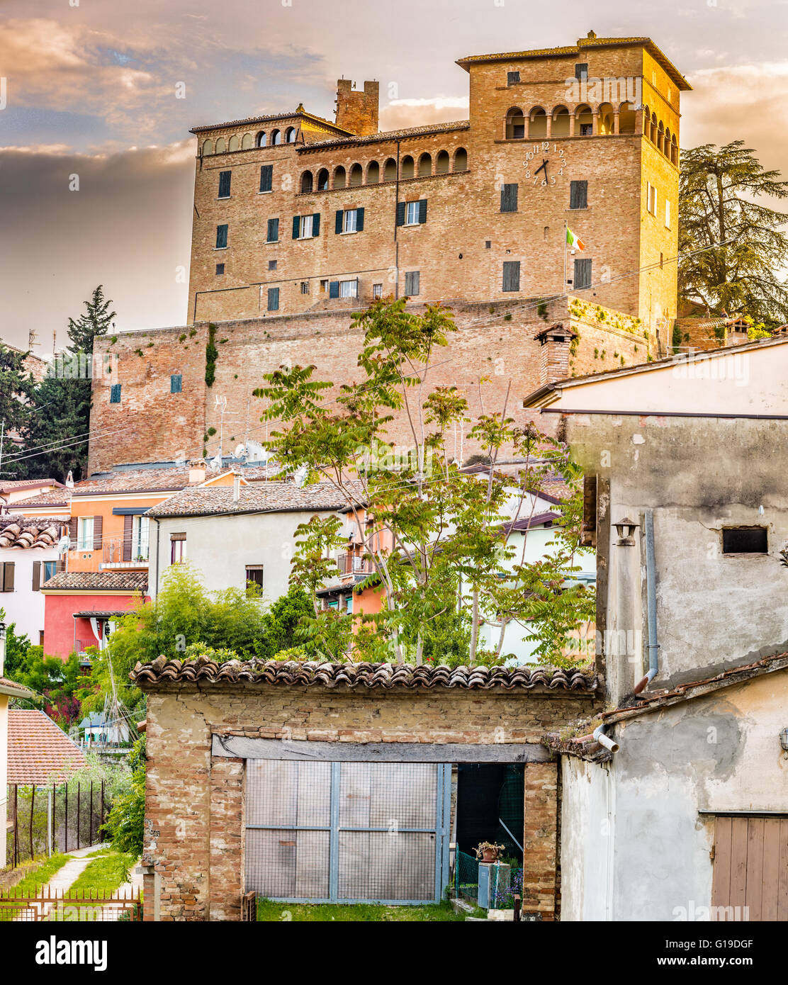 the medieval castle overlooking the colorful houses of the charming mountain town of Longiano, near Cesena, Italy Stock Photo
