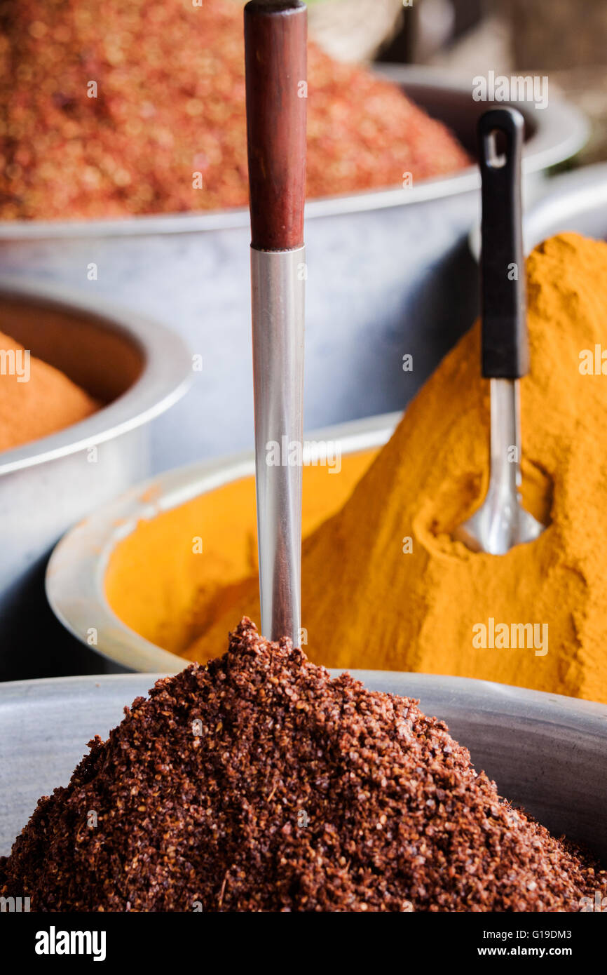 Market stall with a stunning display of colorful Indian spice powders