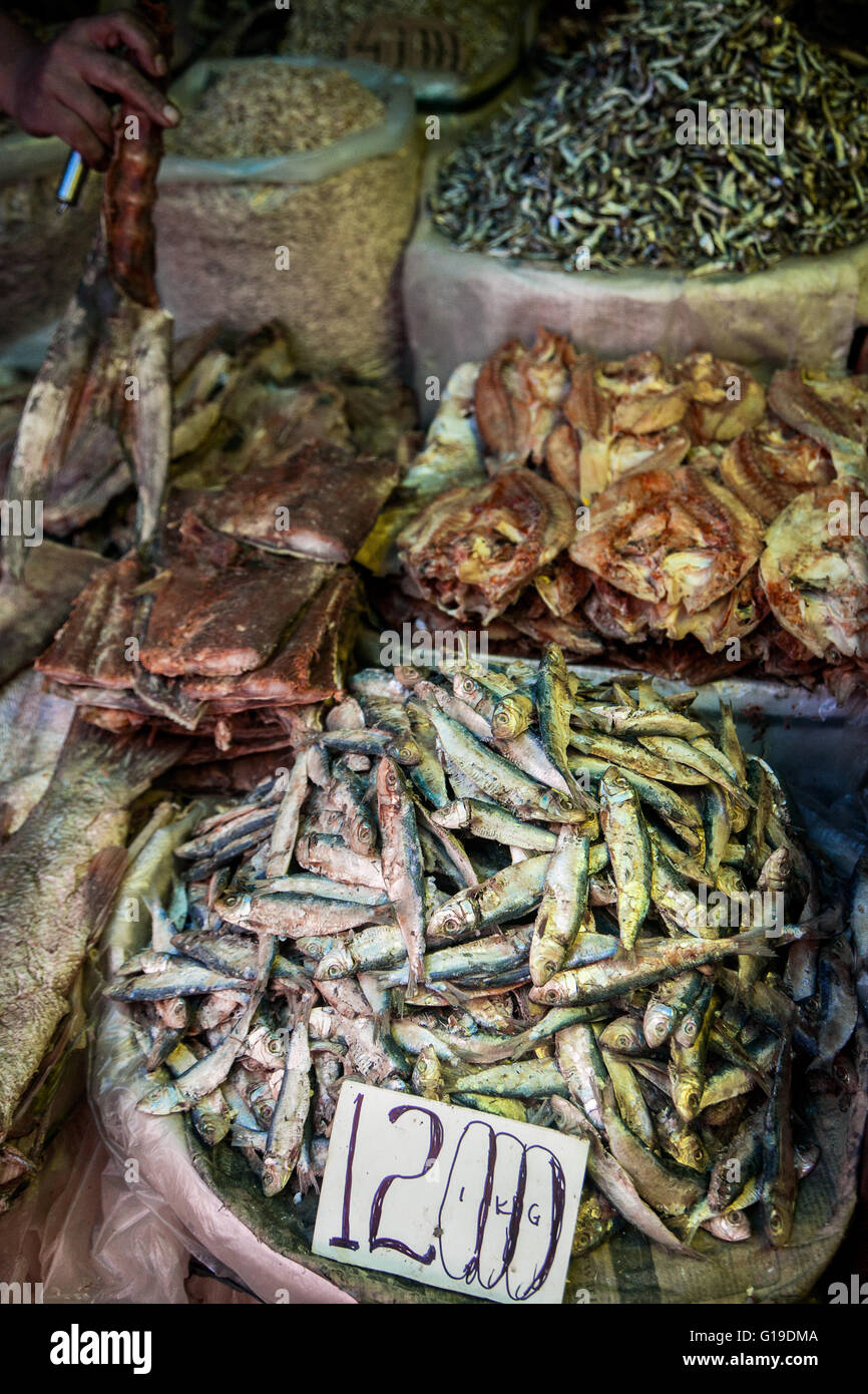 Containers of preserved dried fish displayed on a market stall in Borneo Stock Photo