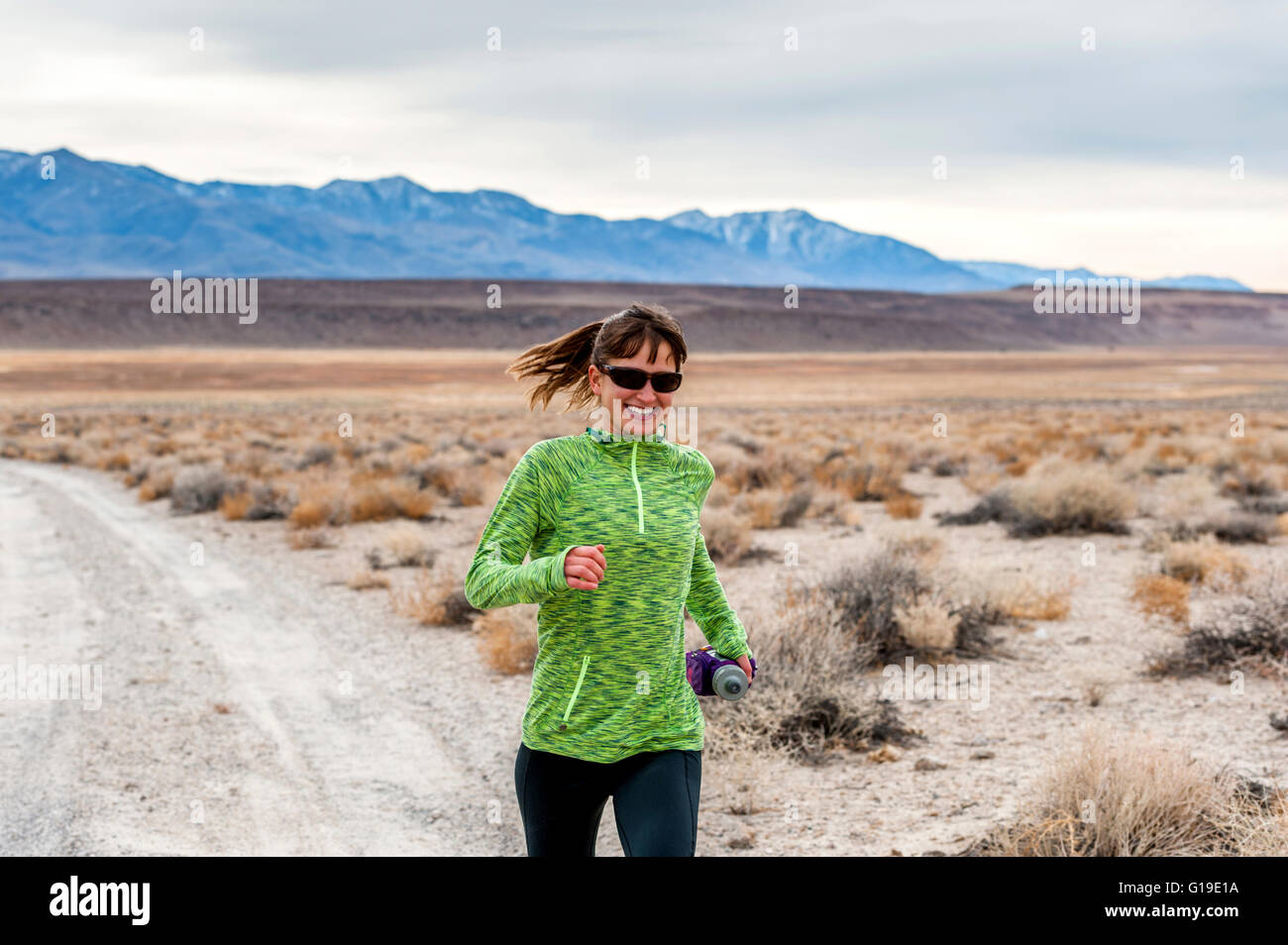 Woman trail running Stock Photo - Alamy