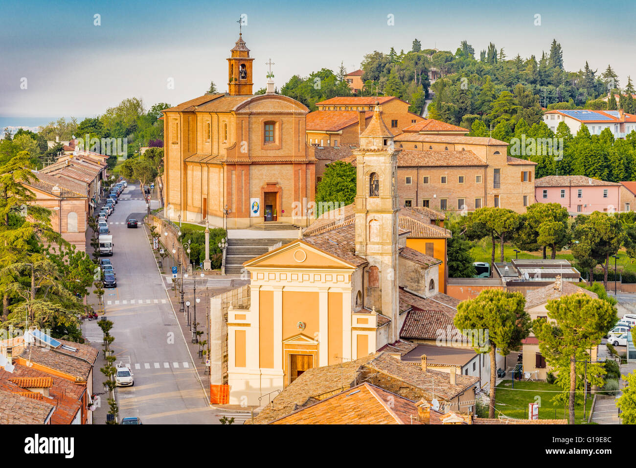 Panorama of the medieval village of Longiano in the Romagna hills near Cesena in Italy, with its ancient buildings and churches and the sea in the distance on the horizon Stock Photo