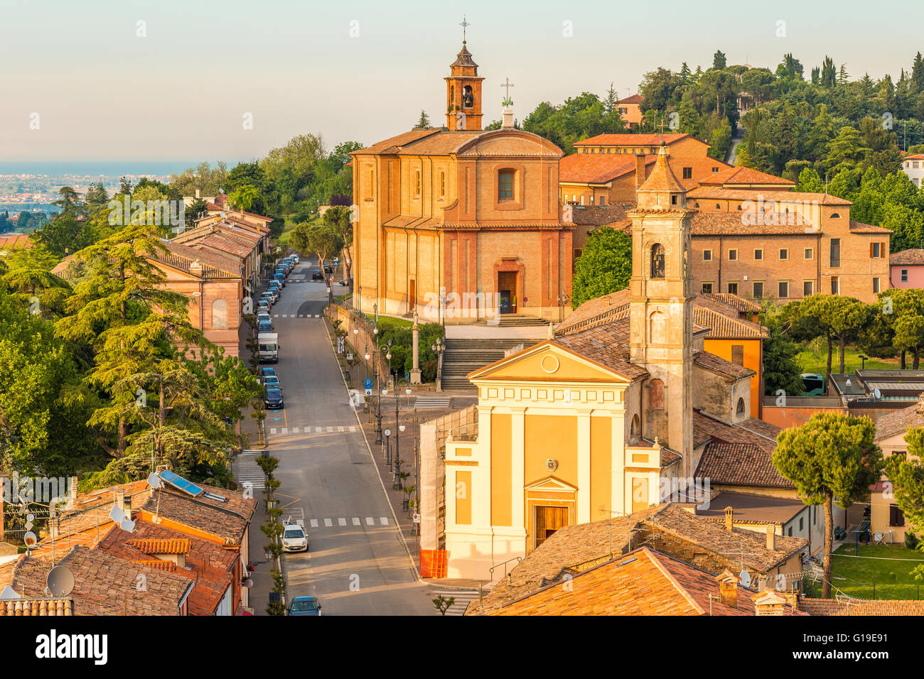 Panorama of the medieval village of Longiano in the Romagna hills near Cesena in Italy, with its ancient buildings and churches and the sea in the distance on the horizon Stock Photo