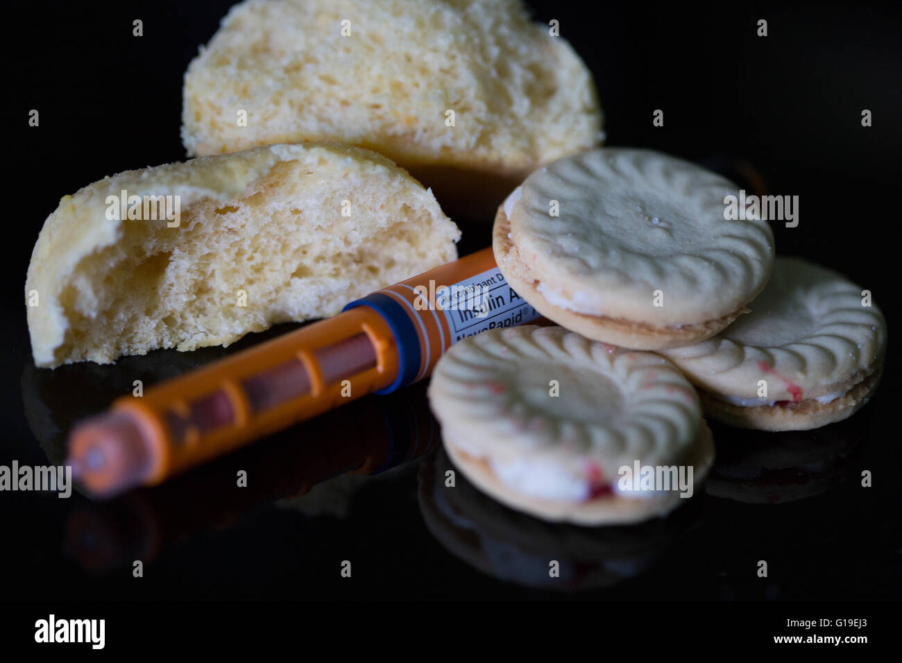 Insulin pen with blood sugar meter & test strip,used in the treatment of Diabetes mellitus.High carbohydrate foods also featured Stock Photo