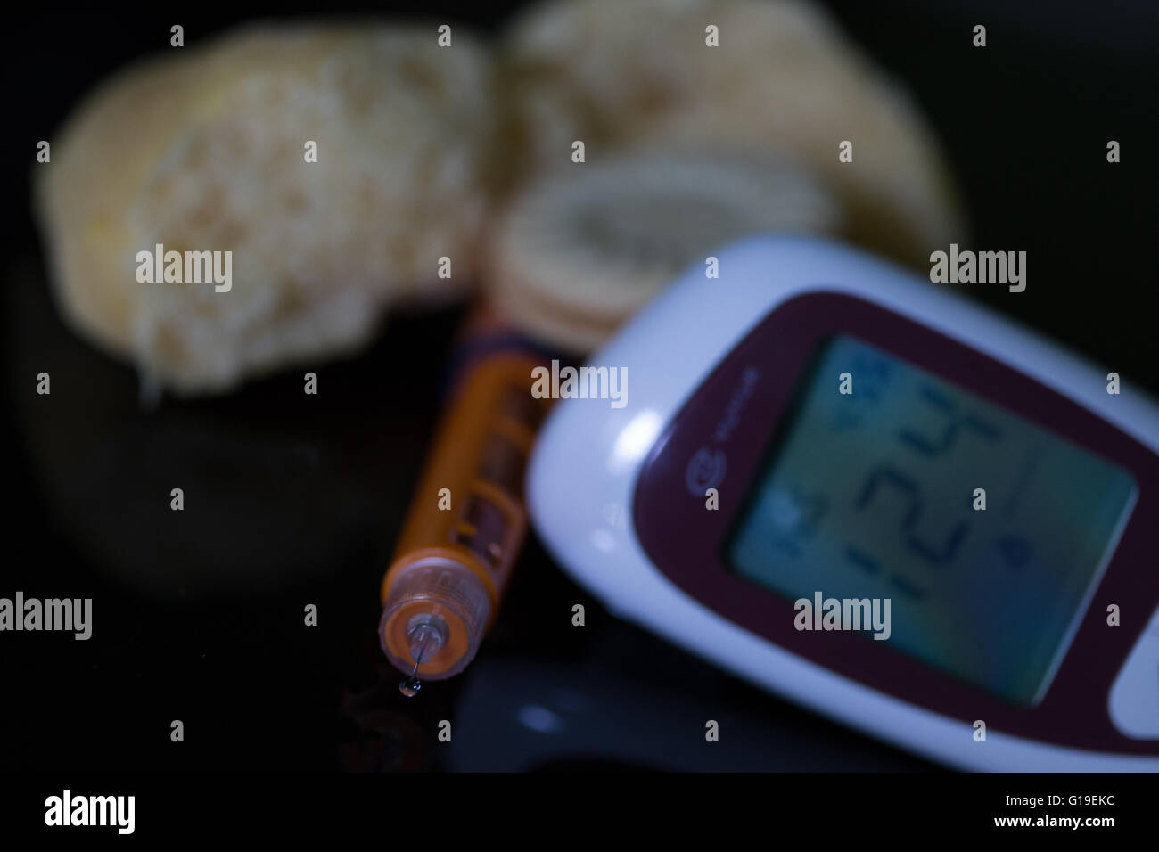 Insulin pen with blood sugar meter & test strip,used in the treatment of Diabetes mellitus.High carbohydrate foods also featured Stock Photo