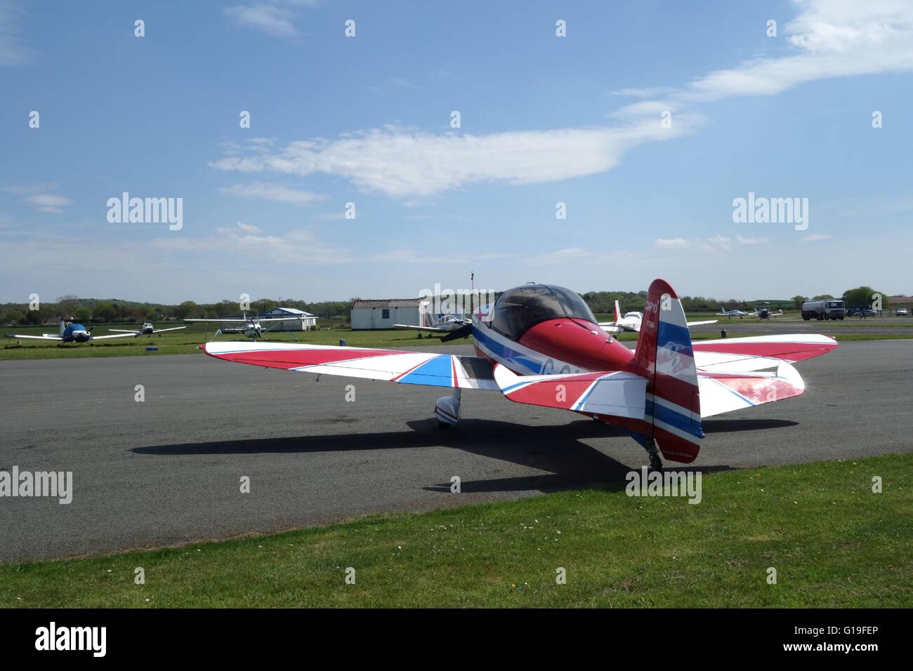 Colourful light aircraft parked at Wolverhampton Halfpenny Green Airfield. UK Stock Photo