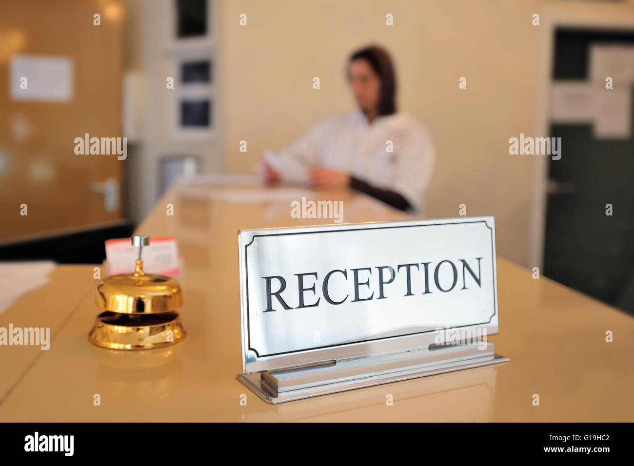 hotel reception desk with bell Stock Photo