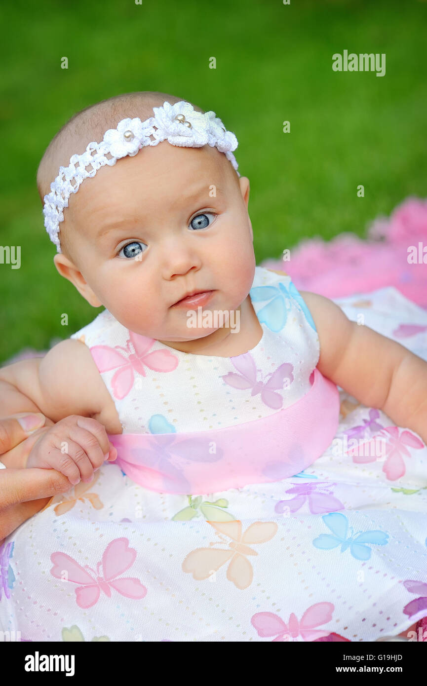 Portrait of a little girl in wreath of flowers Stock Photo - Alamy