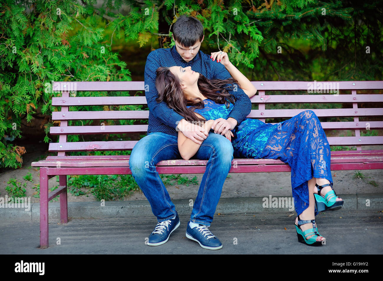 man and woman on a bench Stock Photo