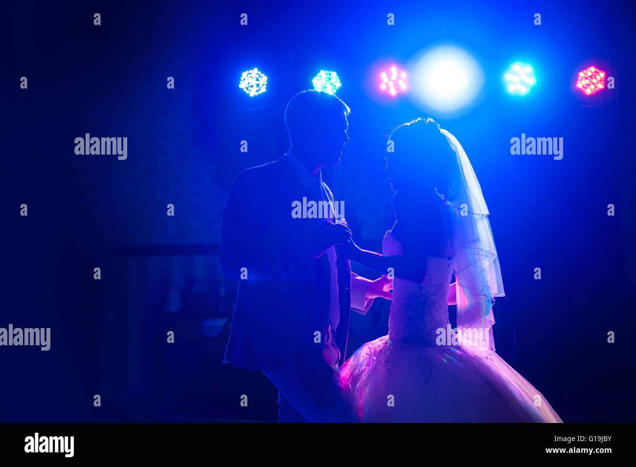 silhouette dancing bride and groom Stock Photo