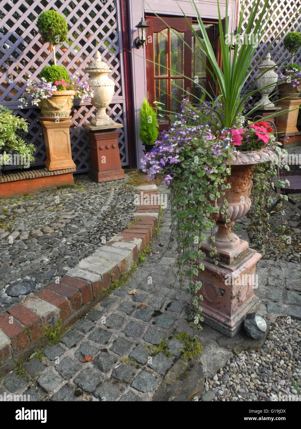 Well designed garden with trellis Stock Photo