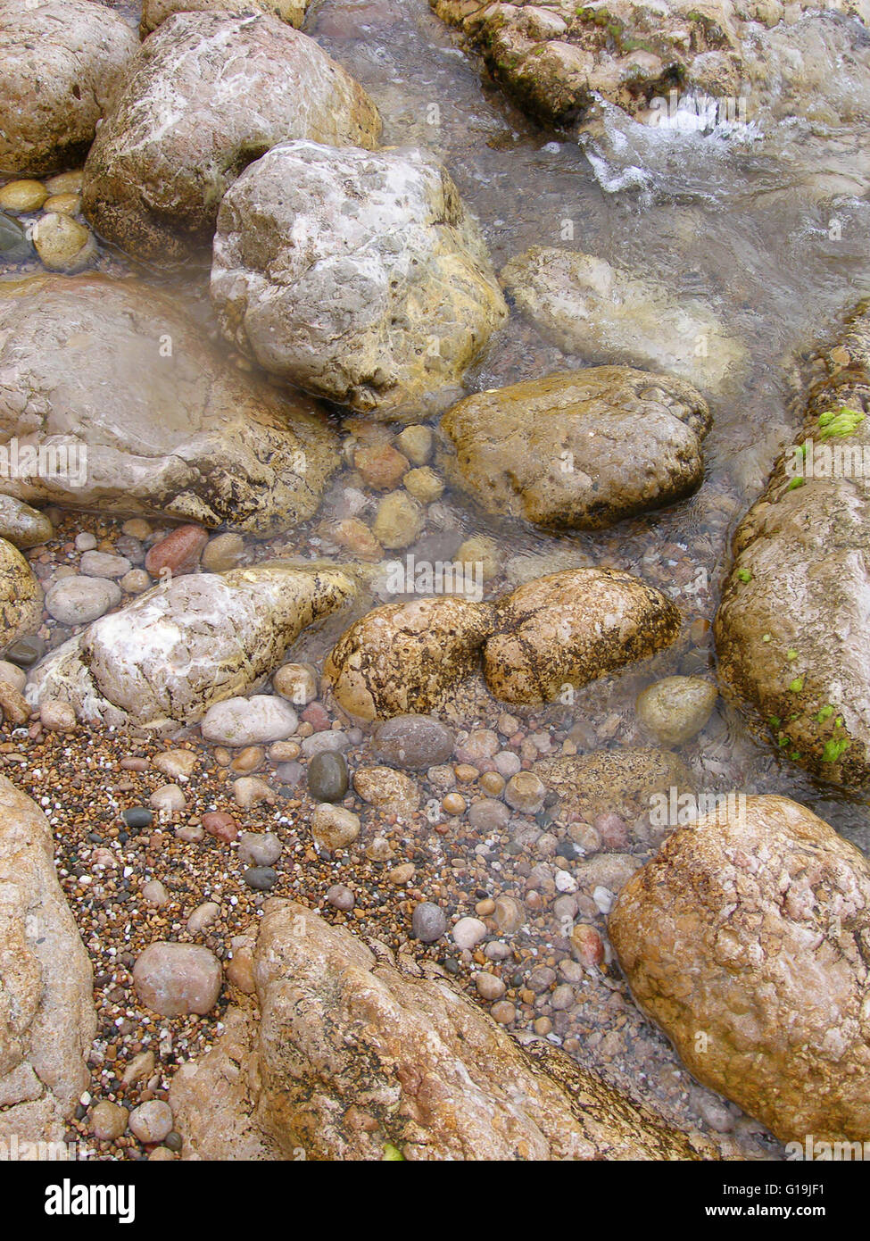 Colorful stone in water Stock Photo - Alamy