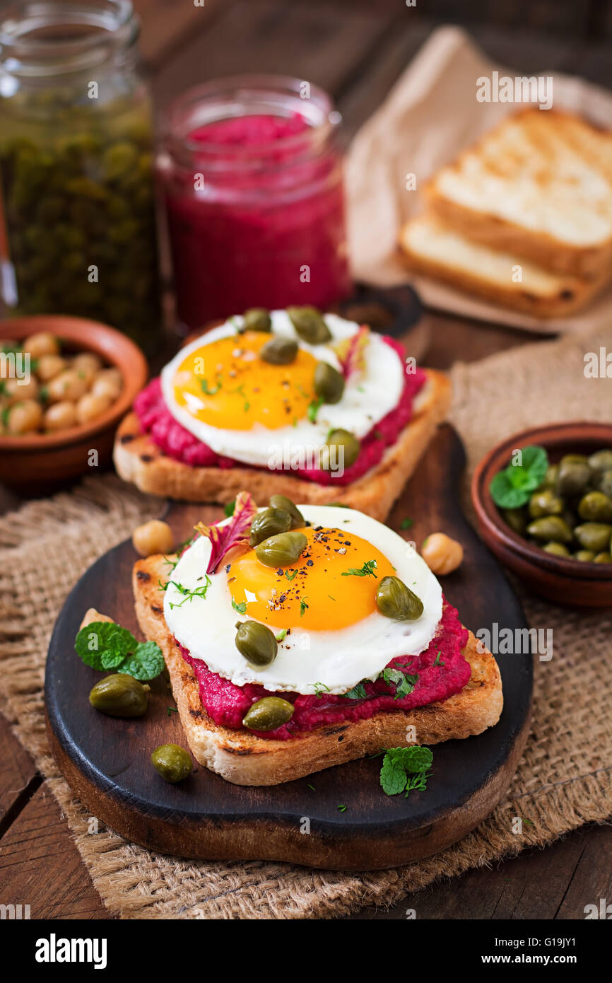 Diet sandwiches with beet root hummus, capers and egg Stock Photo Alamy