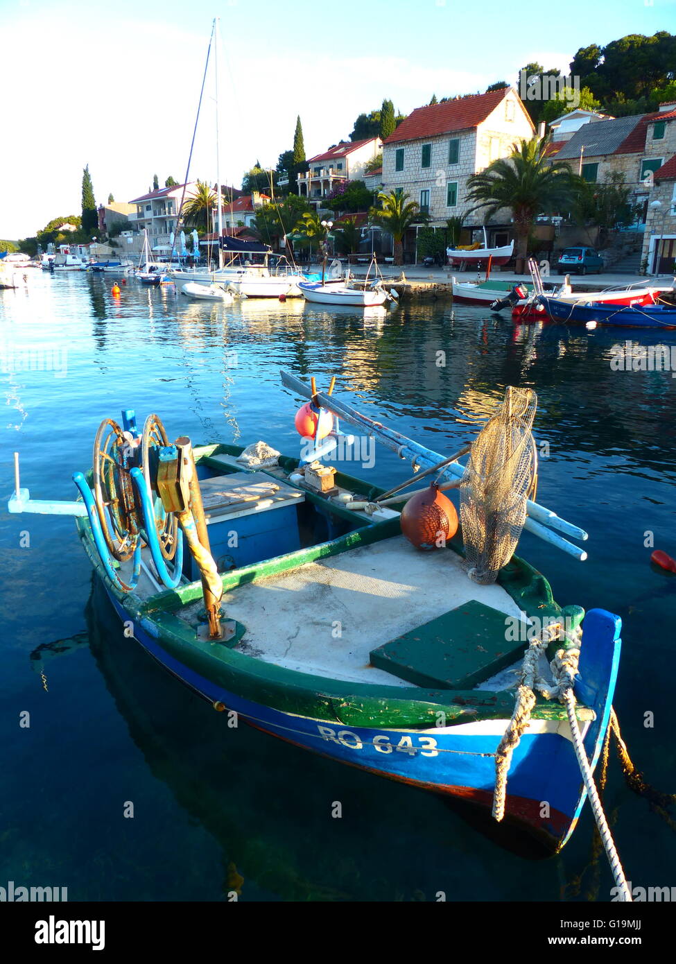 Fishing boat in calm waters Stock Photo Alamy