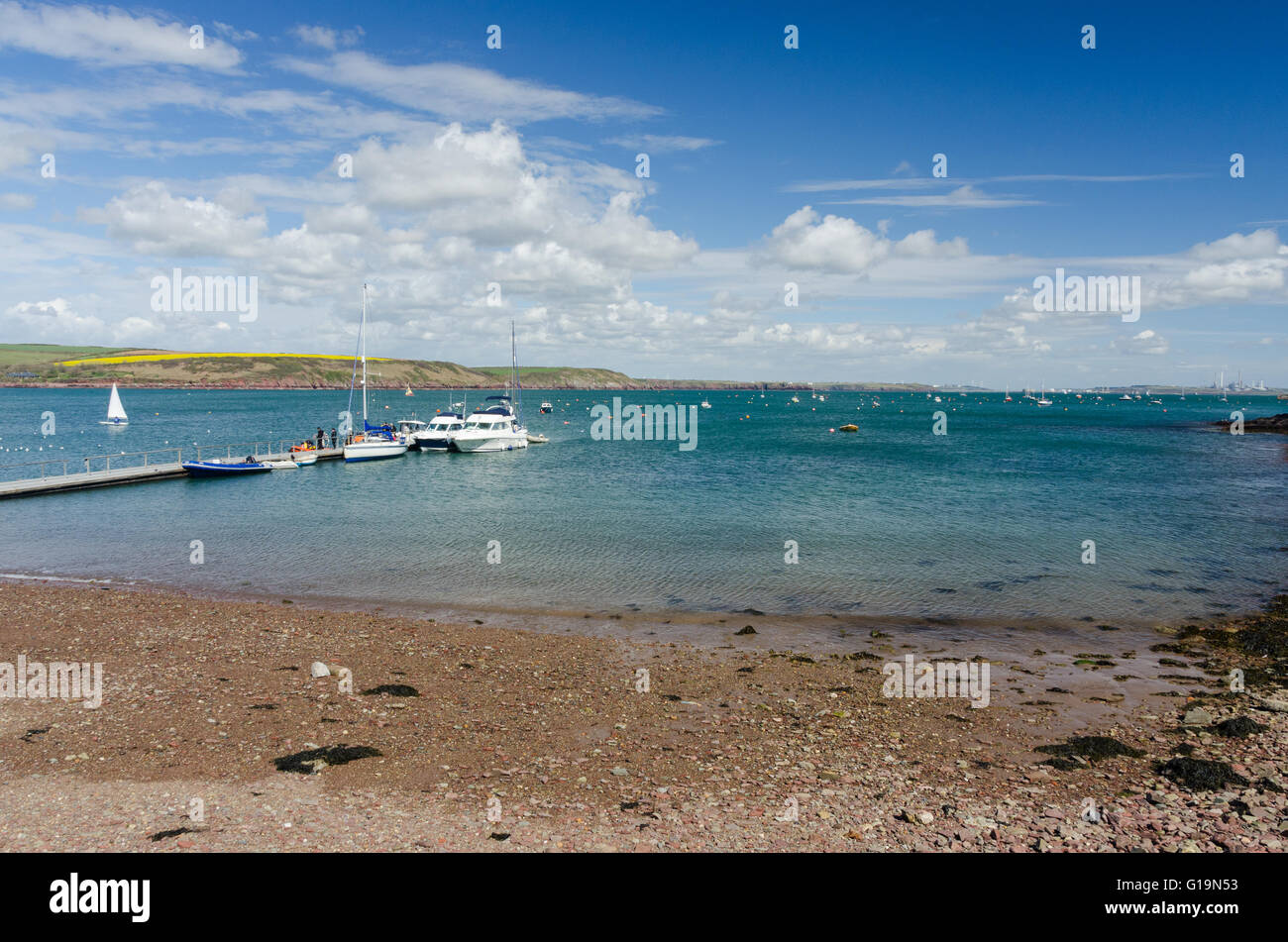 Boats moored on the pontoon at Dale on the Milford Haven Estuary in Pembrokeshire Stock Photo