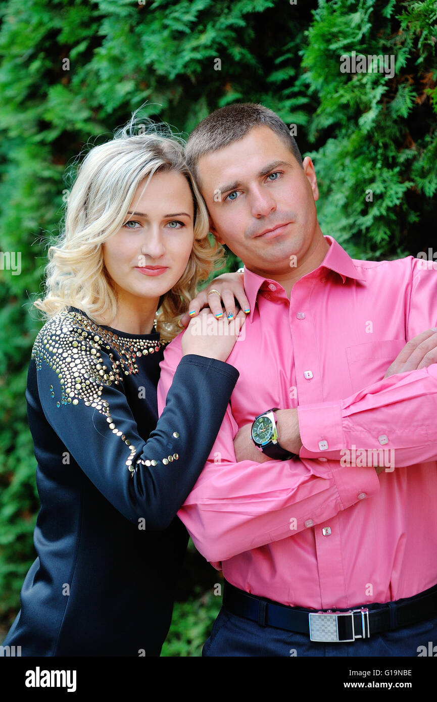 Happy young attractive couple portrait, smiling in outdoor envir Stock Photo