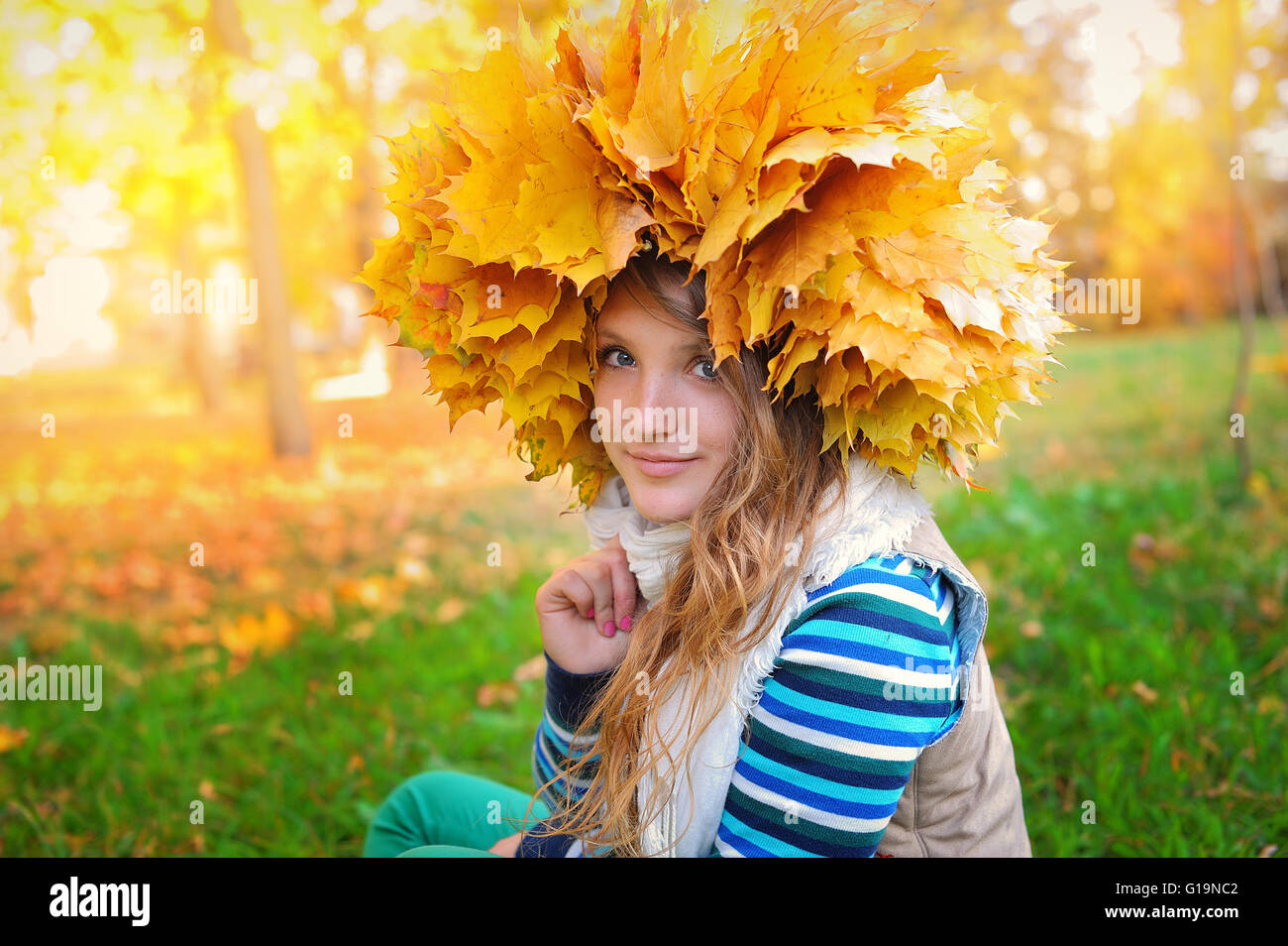 Young pretty woman in the autumn park Stock Photo