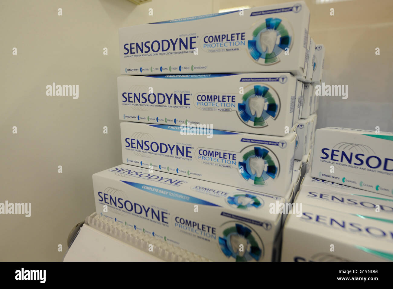 Sensodyne toothpaste in store at a Boots pharmacy Stock Photo