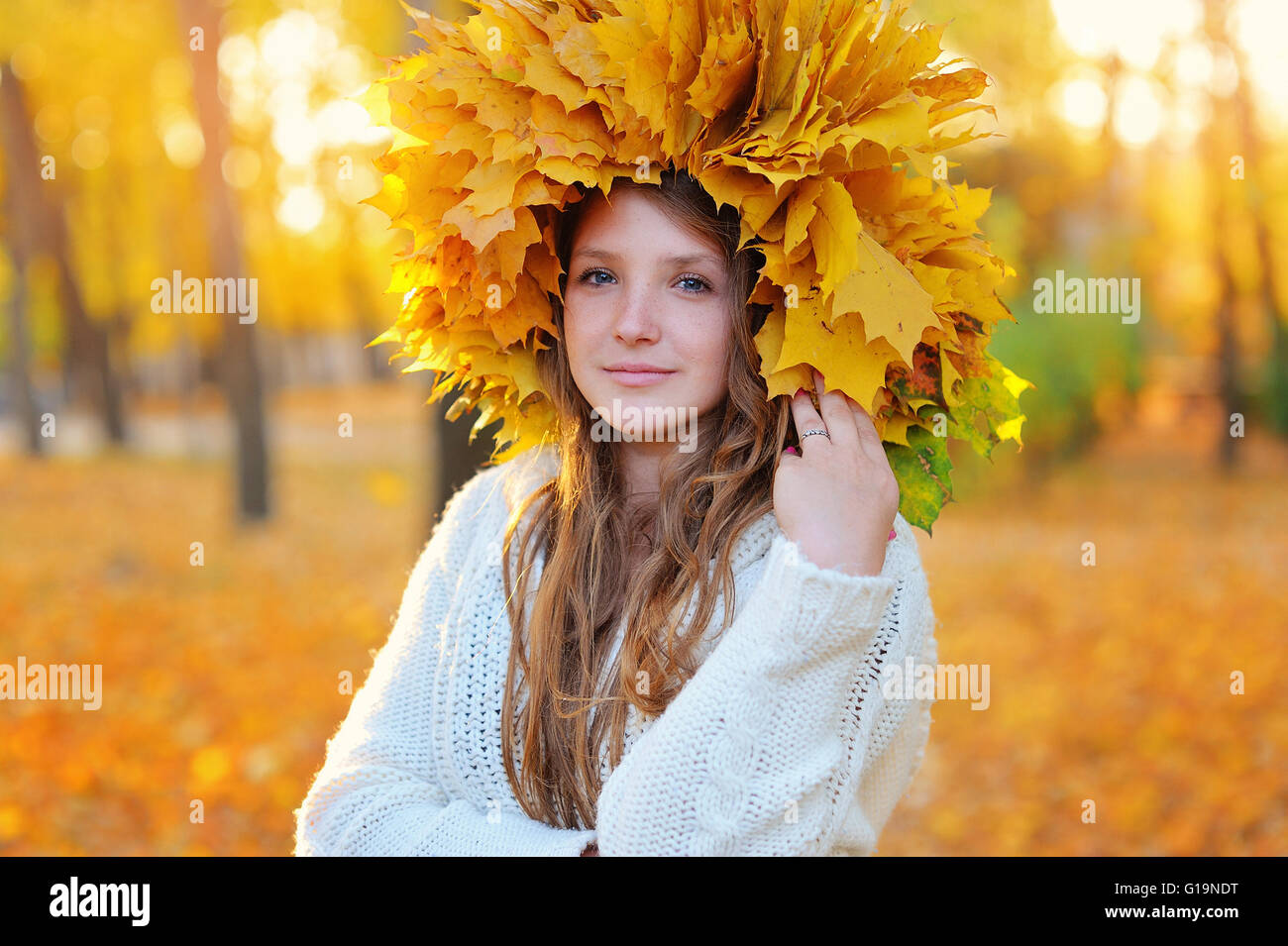 Autumn Woman. Blonde Girl and Yellow Leaves. Portrait. Fall Stock Photo