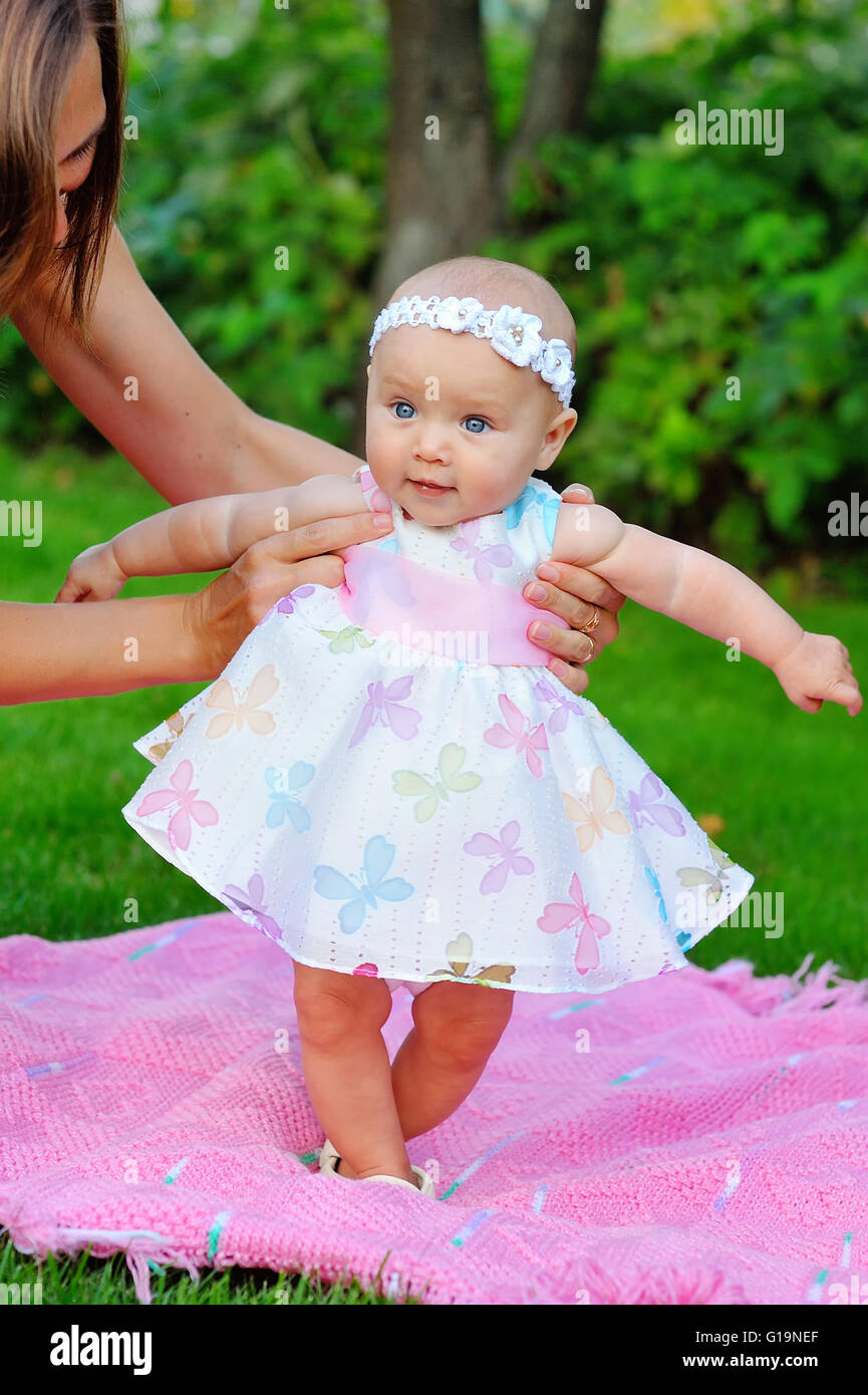 baby girl in a pink dress Stock Photo