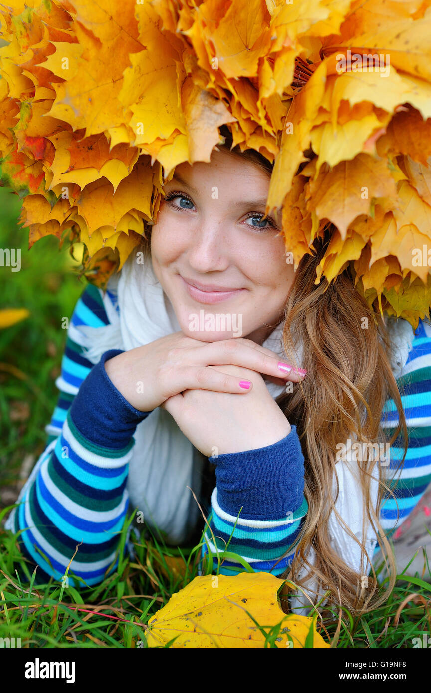 Happy smiling girl in autumn park, top view Stock Photo - Alamy
