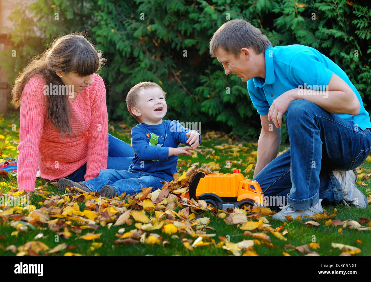 happy family playing in the park in autumn Stock Photo