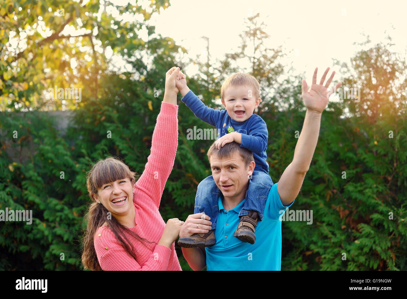 happy parents and son enjoyed a walk in the park Stock Photo