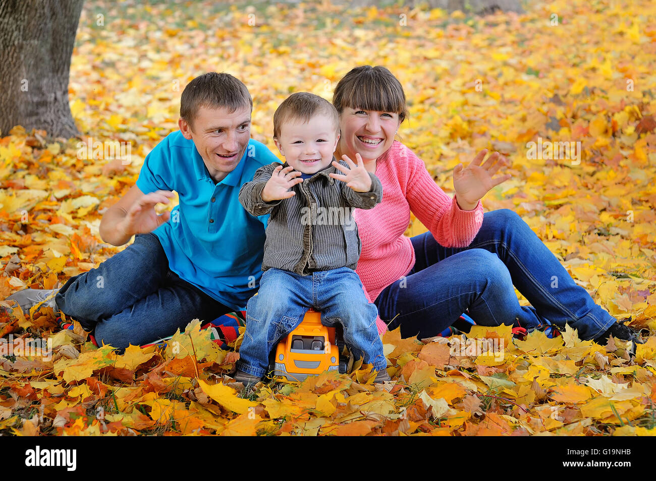 happy family in the park in autumn Stock Photo