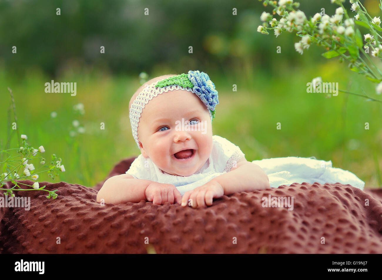 Happy baby girl in park Stock Photo