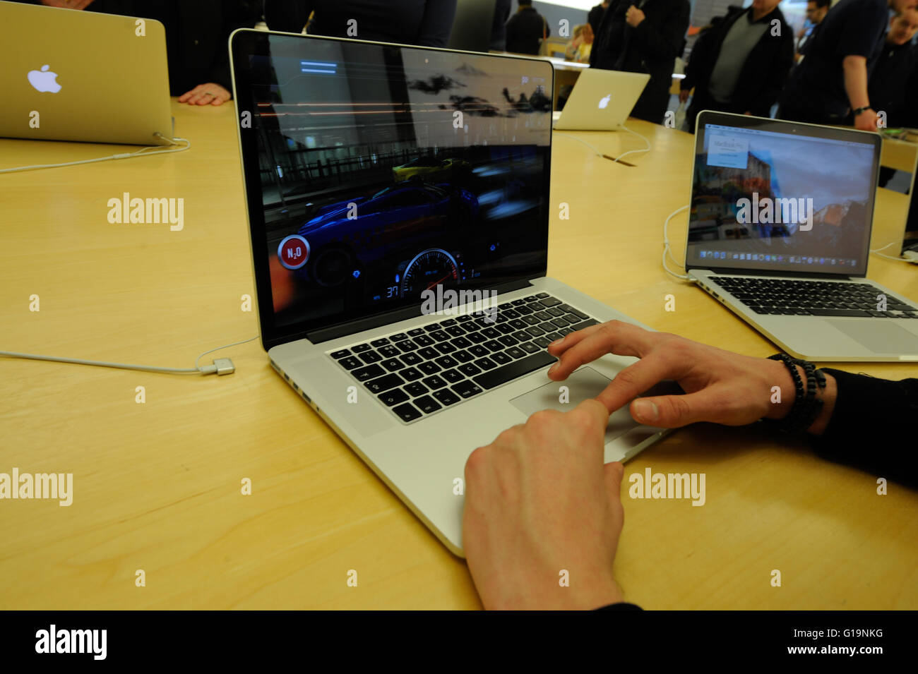 Apple store in cardiff st davids centre, someone using a mac book pro Stock Photo