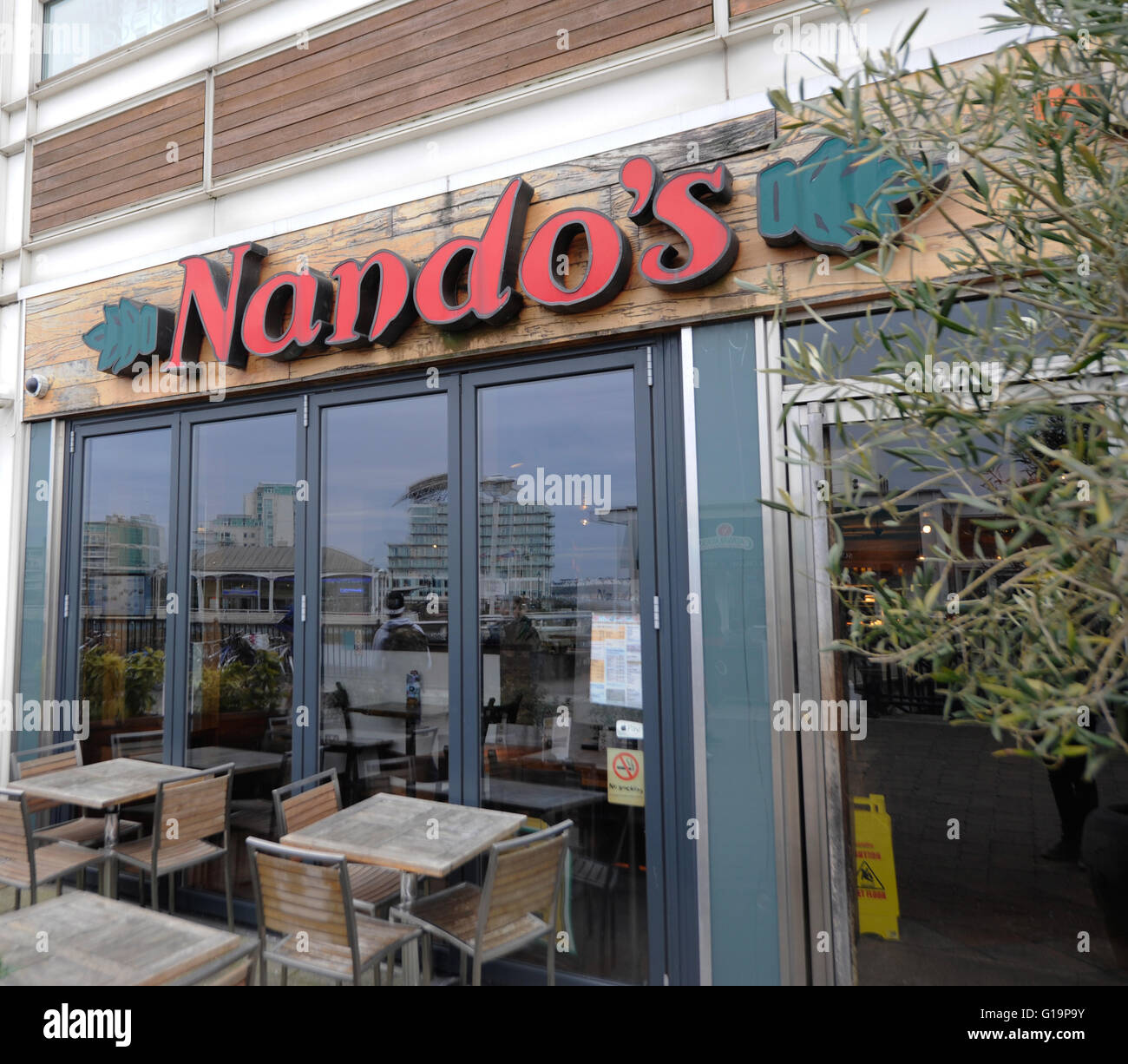 Nando's Restaurant exterior sign in Cardiff Bay - United Kingdom Stock Photo