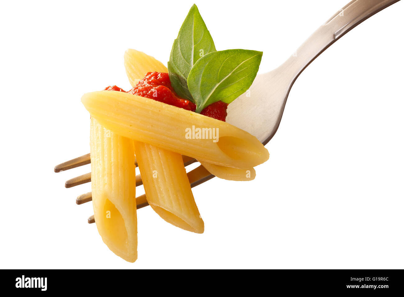 Penne rigate pasta with tomato sauce and basil on a fork. Clipping path, infinite depth of field Stock Photo