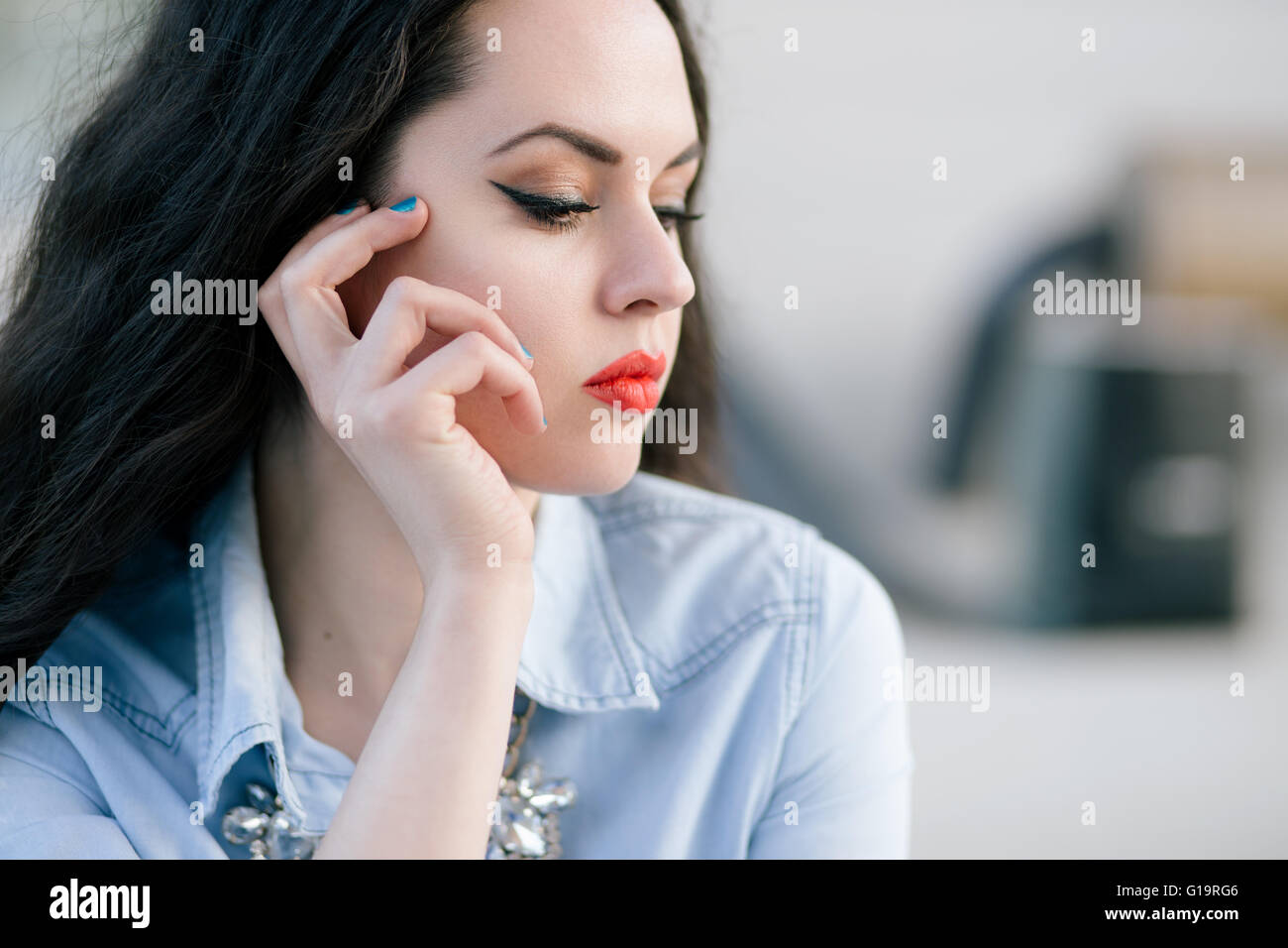 Closeup portrait of a young woman with dark hair Stock Photo