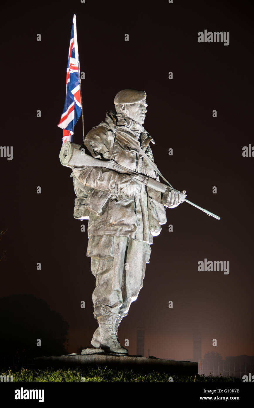 A floodlit Royal Marines 'Yomper' memorial statue at the former Royal