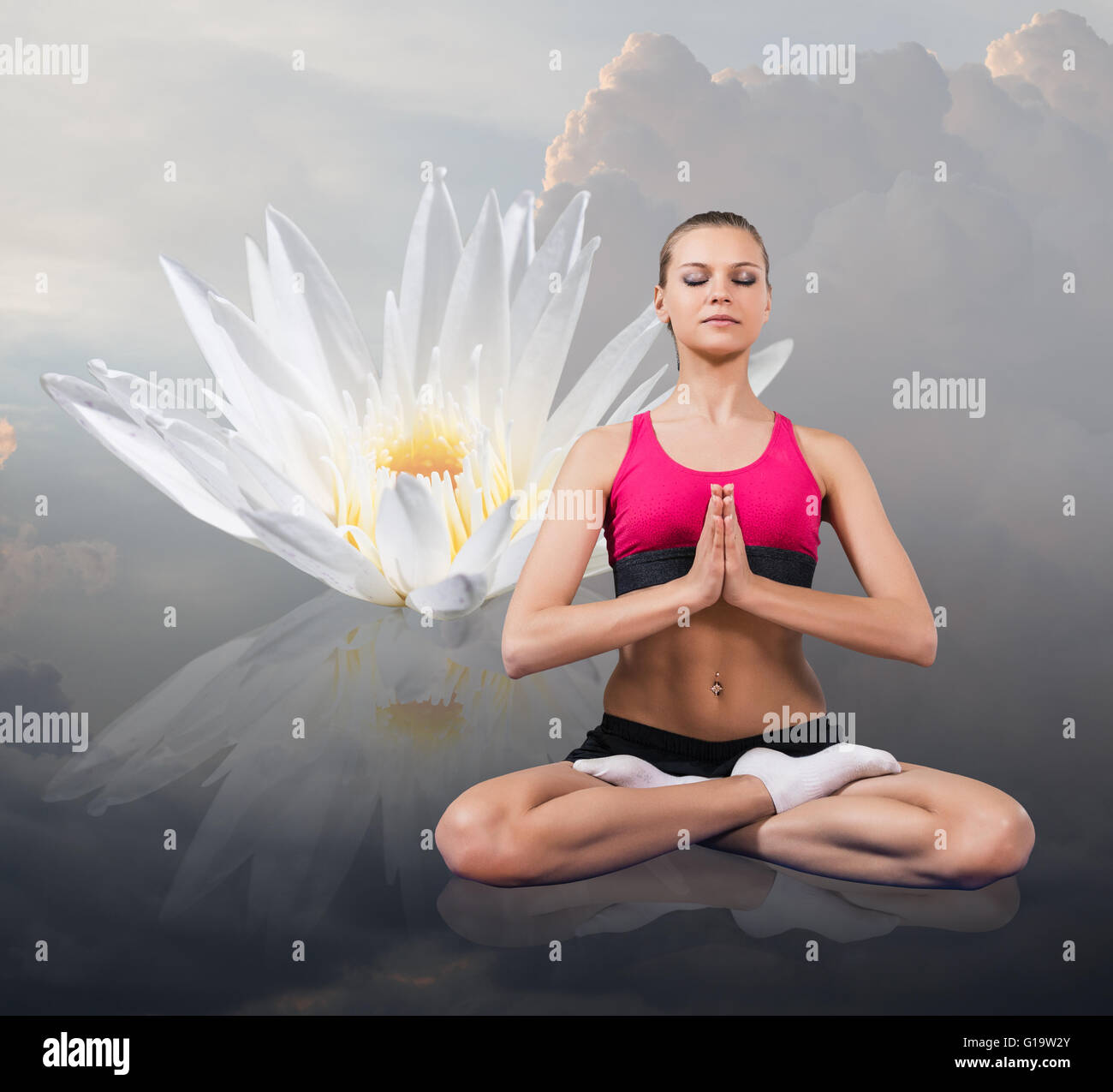 Young woman sitting in lotus position isolated on white Stock Photo - Alamy