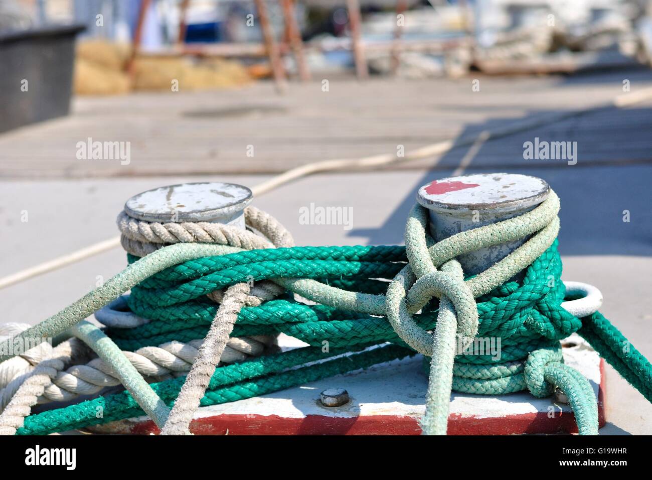 Marine rope on mooring bollard in port of Podgora, Croatia. Horizontal photo Stock Photo