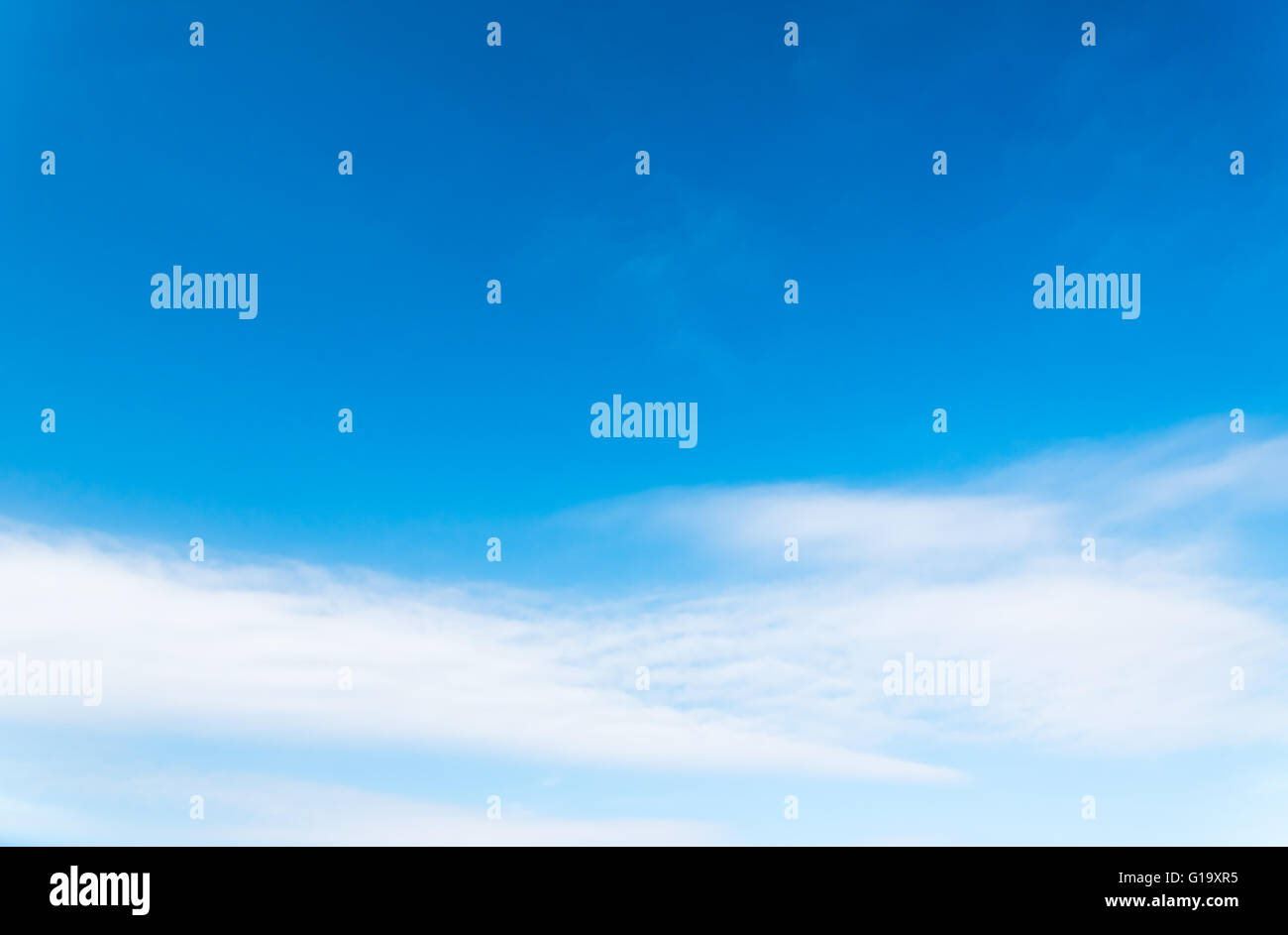 Blue sky with some white cirrus clouds. Natural background Stock Photo