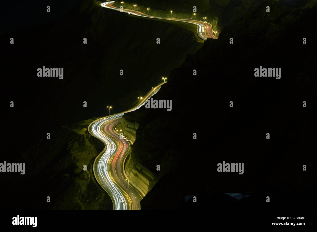Slide Hilly Light, Photo taken on the on of the cliff of Al Hada Hill Road, Al Hada Thaif, Saudi Arabia, in the night time with Stock Photo