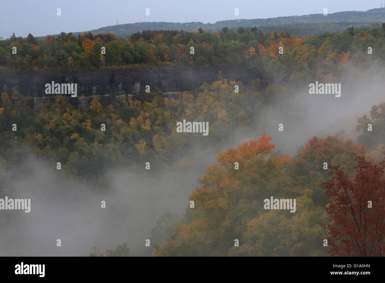 clouds in hills fall colors trees John Boyd Thacher State Park Albany, New York Stock Photo