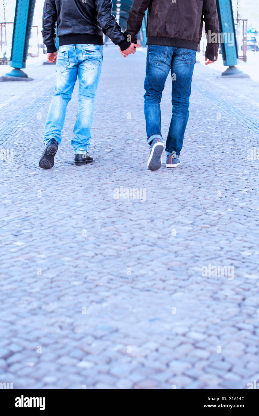 Young gay men holding hands hi-res stock photography and images - Alamy