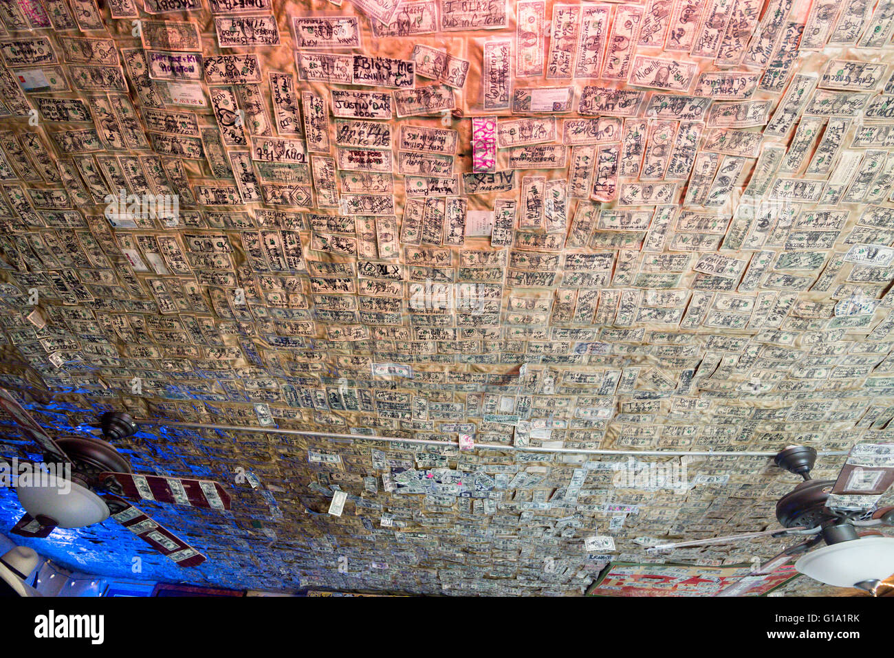 Dollar bills on the ceiling of the No Scum Allowed saloon in White Oaks, New Mexico. Stock Photo