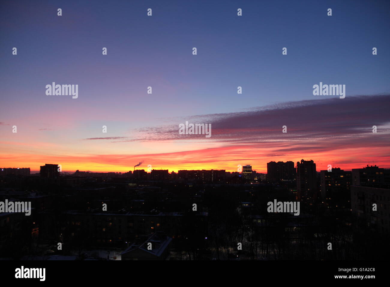 Beautiful dramatic sunrise with red sky the city Stock Photo - Alamy