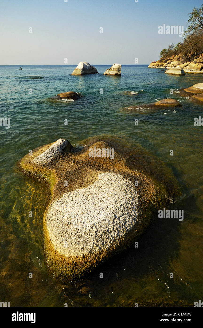 Rounded rocks in water at Ilala Gap, Lake Malawi National Park Stock Photo