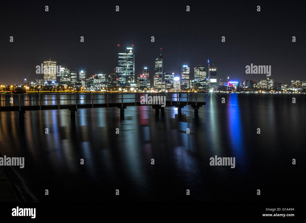 Perth skyline at night with jetty in foreground Stock Photo