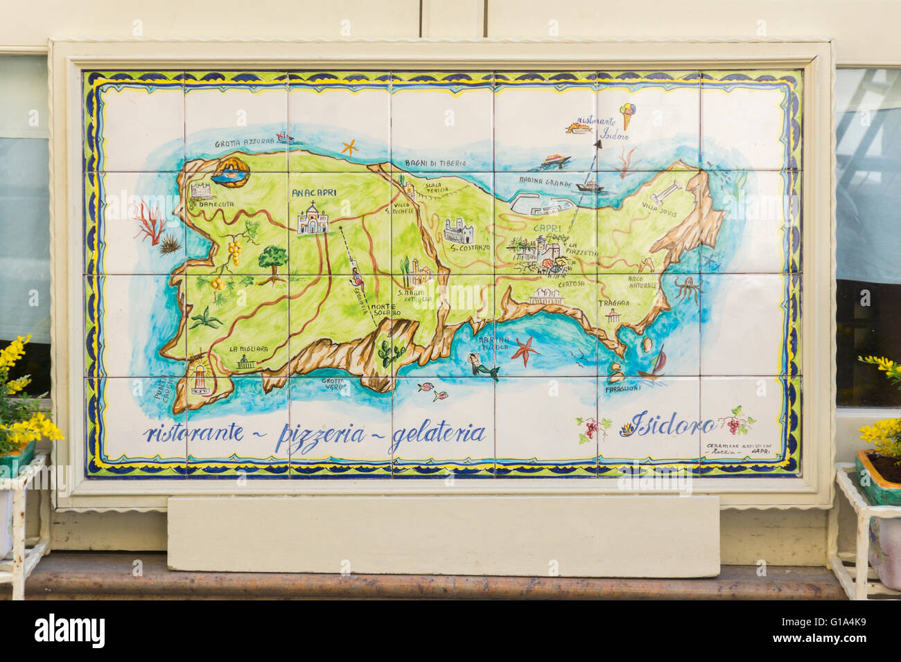 Colourful hand painted ceramic tiles depicting a map of Capri island as an advertisement outside the restaurant Isidoro on the Via Roma. Capri, Italy Stock Photo