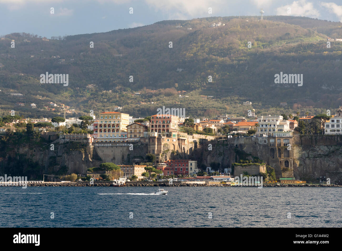 The Sorrento coastline, cliffs, clifftop hotels and buildings from the Gulf of Naples sea & the hills of the Sorrentine Peninsula behind. Italy Stock Photo